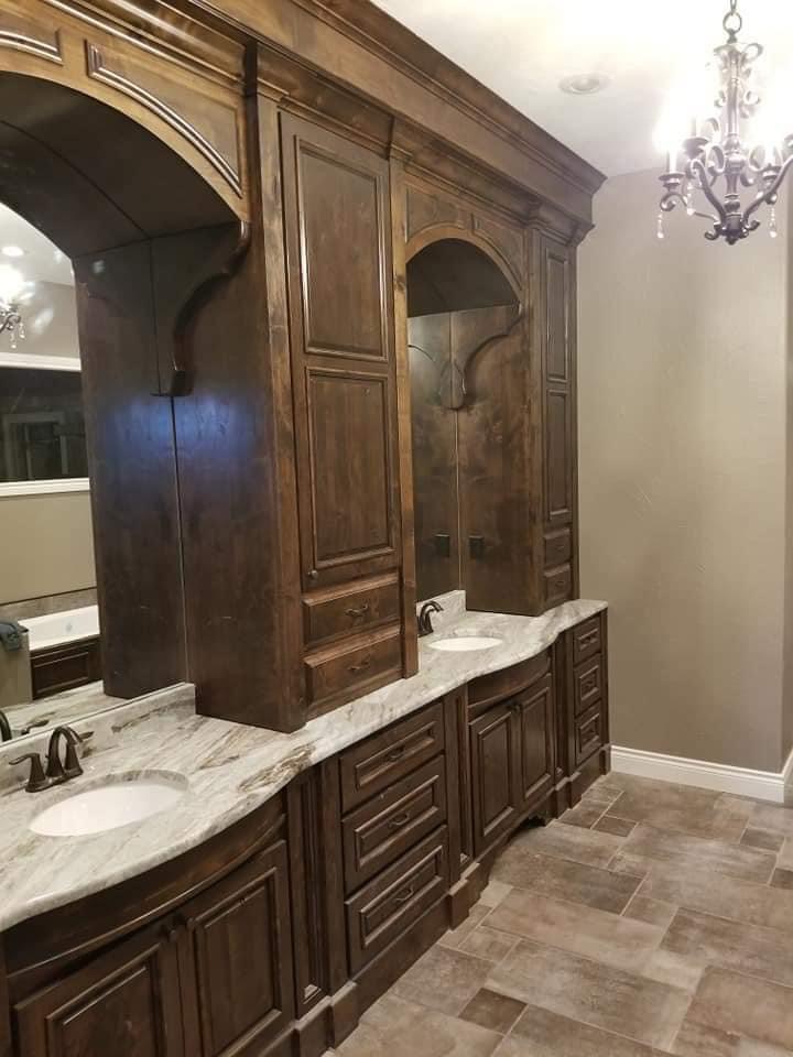 Refinished dark stained vanity cabinetry with new hardware in Nixa, Missouri