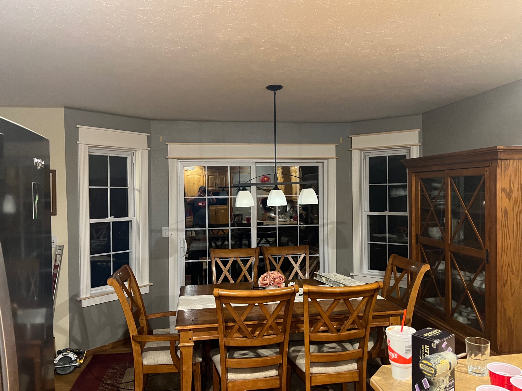Completed custom trim carpentry around dining room windows and patio door near Springfield, MO