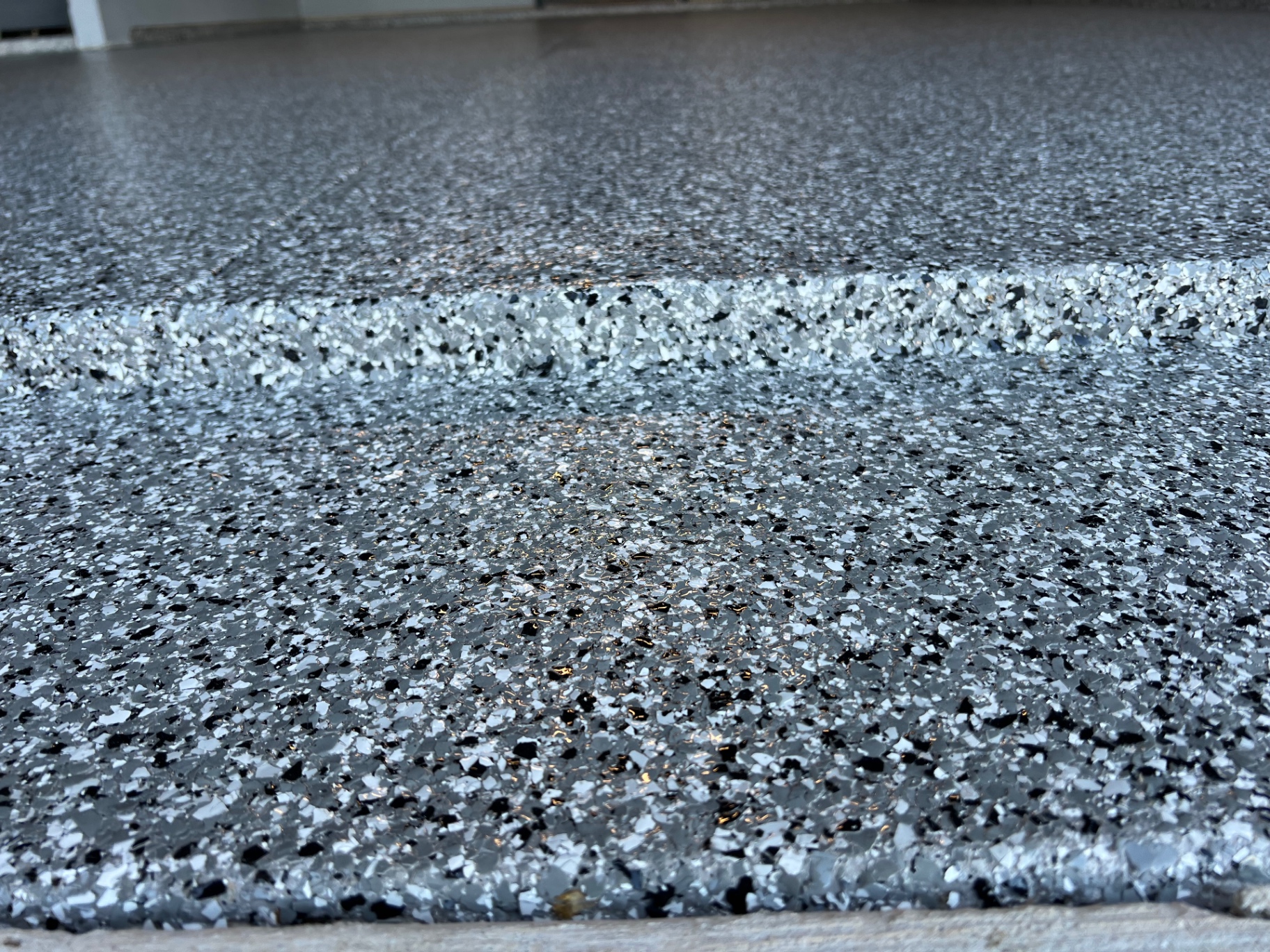 Gray flake epoxy garage floor close-up in Springfield, MO
