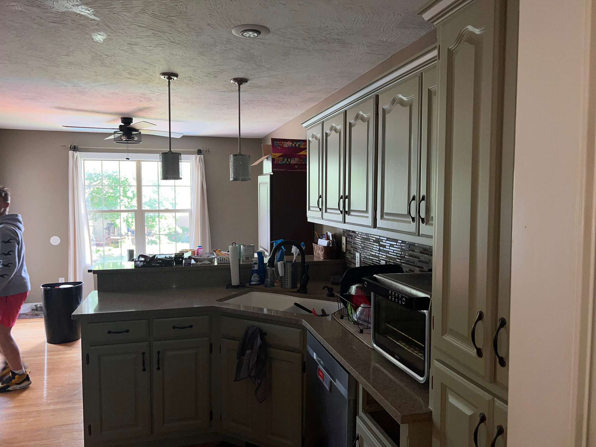 Sage green cabinet refinishing in a Springfield, Missouri kitchen