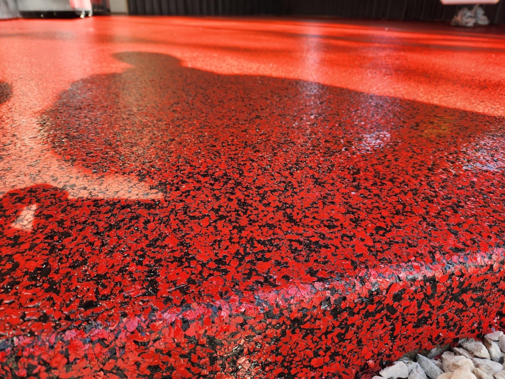 Red and black flake epoxy step detail in Republic, MO