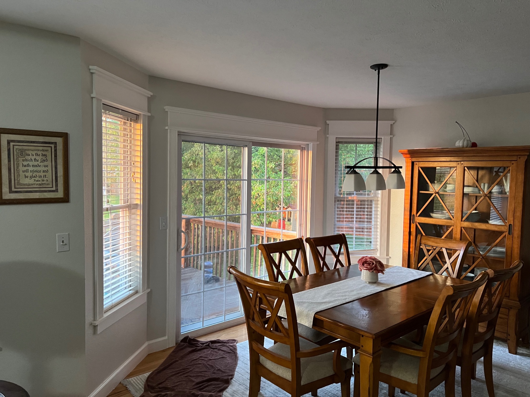 Bright dining room with completed custom window and sliding door trim in the Ozarks