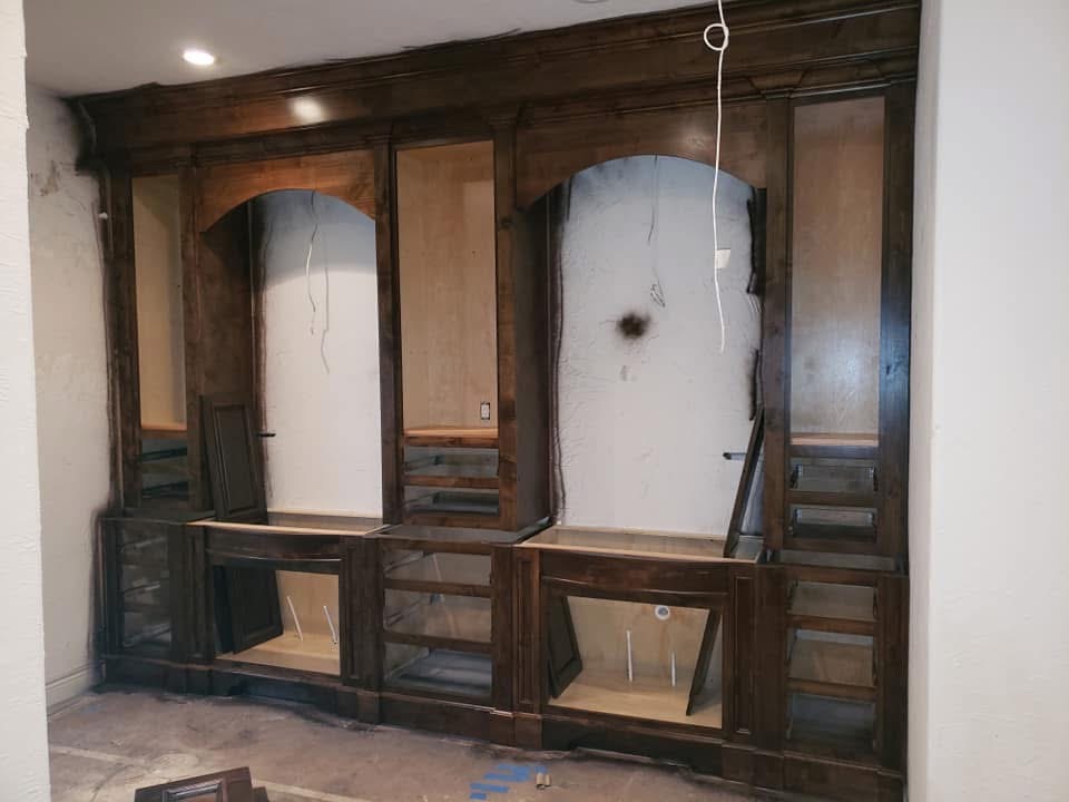 The same built-in cabinetry after a dark stain and finish were applied